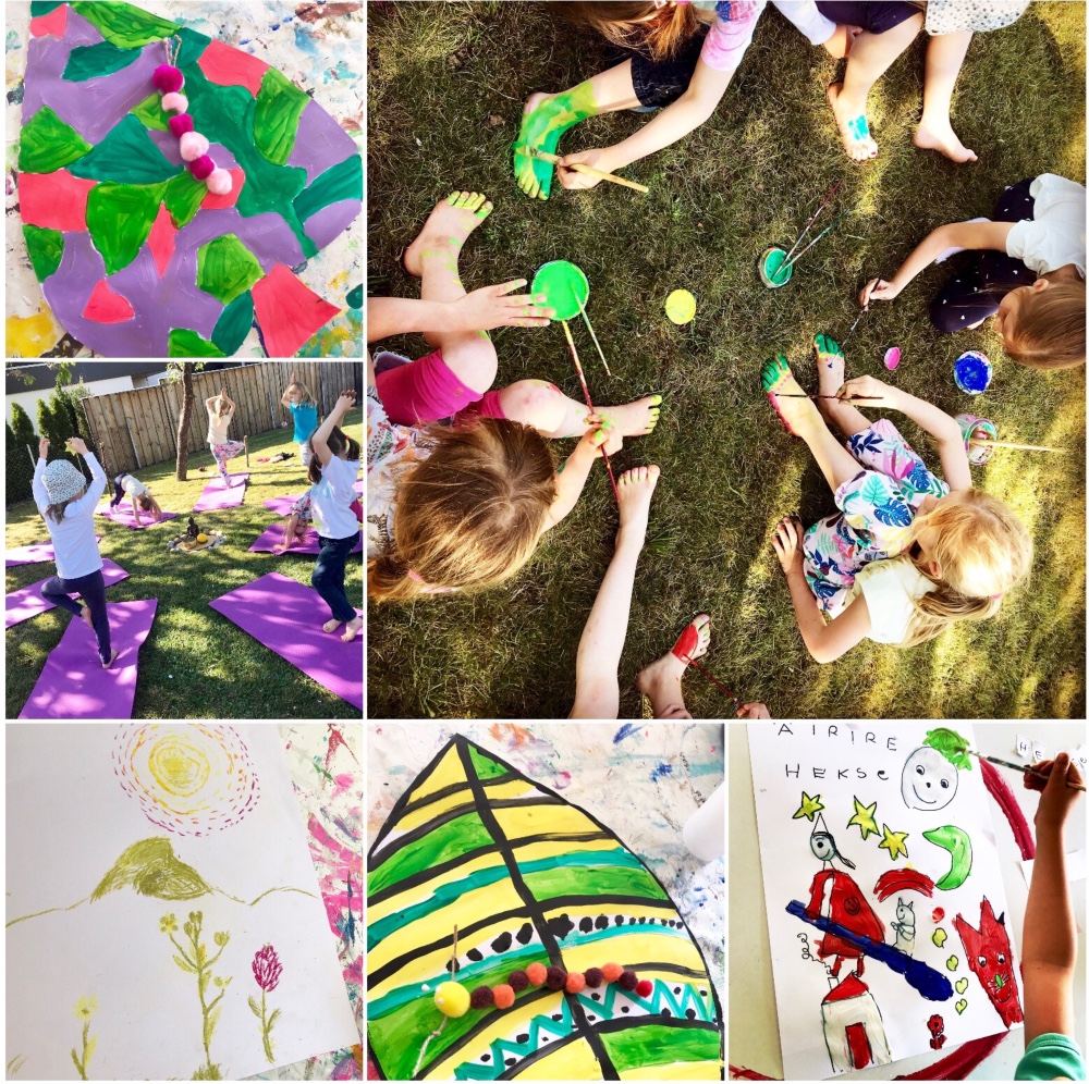 Kinder gestalten gemeinsam kreative Bilder im Freien